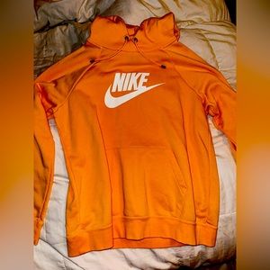 this is an orange nike sweatshirt, size L , comfortable